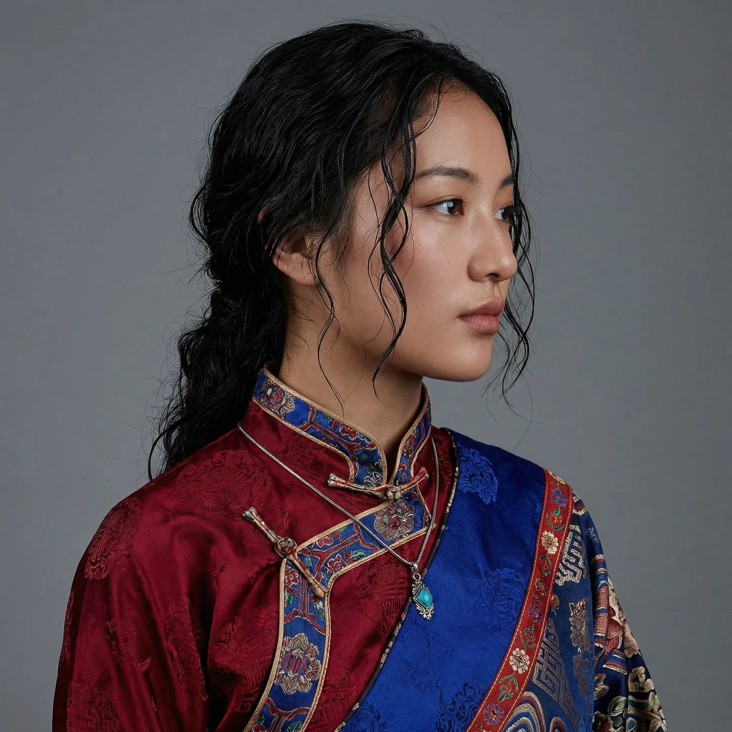 A model wearing the turquoise shield necklace, highlighting its versatility for daily spiritual wear.