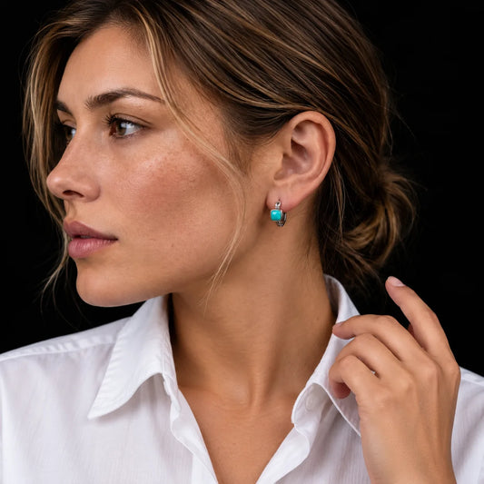 Axiom natural turquoise huggie earring in 925 sterling silver — worn profile view