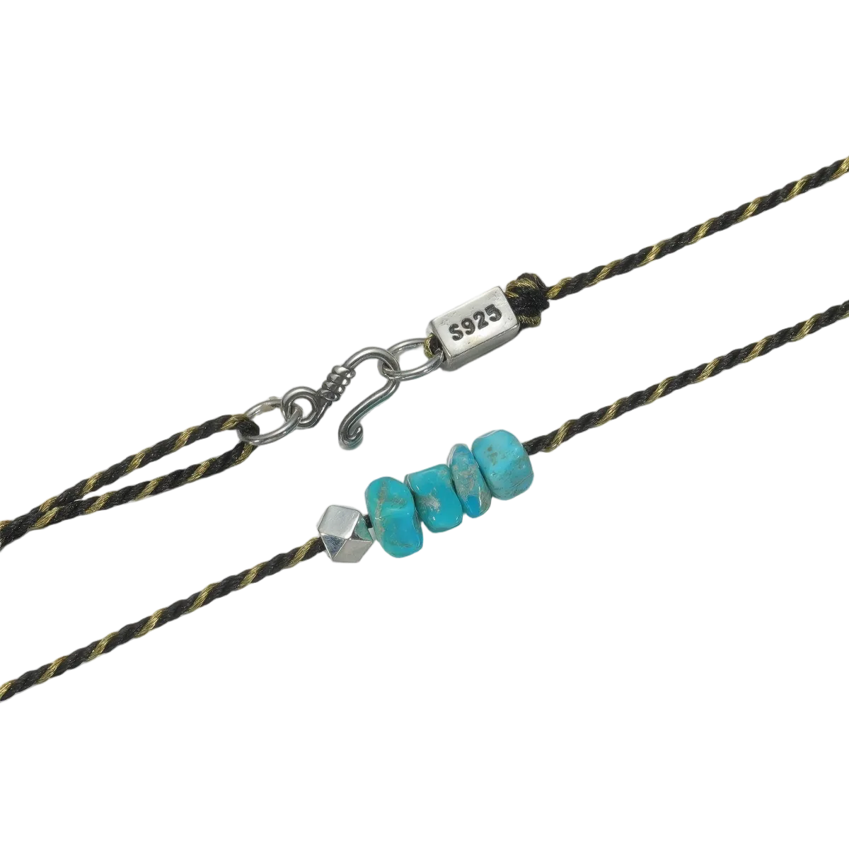 Detailed view of the handcrafted geometric 925 silver bead and the raw Tibetan turquoise chips.