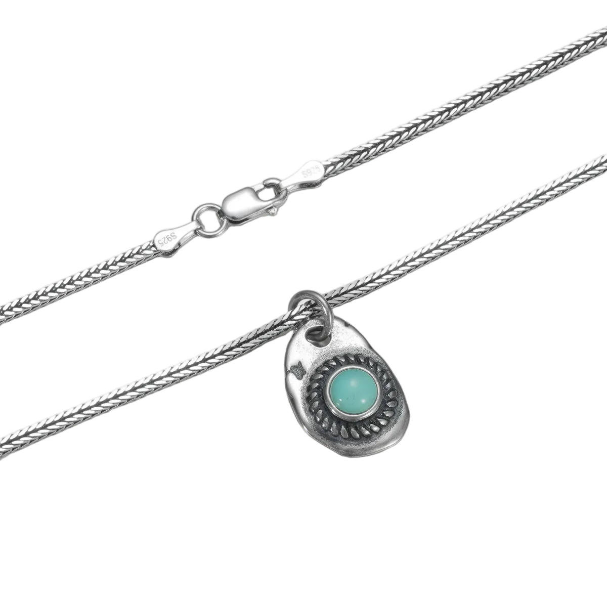Detailed view of the woven sterling silver chain and the hand-finished sunburst texture of the pendant.