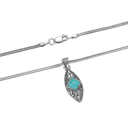 Detailed view of the 925 sterling silver chain and the intricate carved shield pendant.