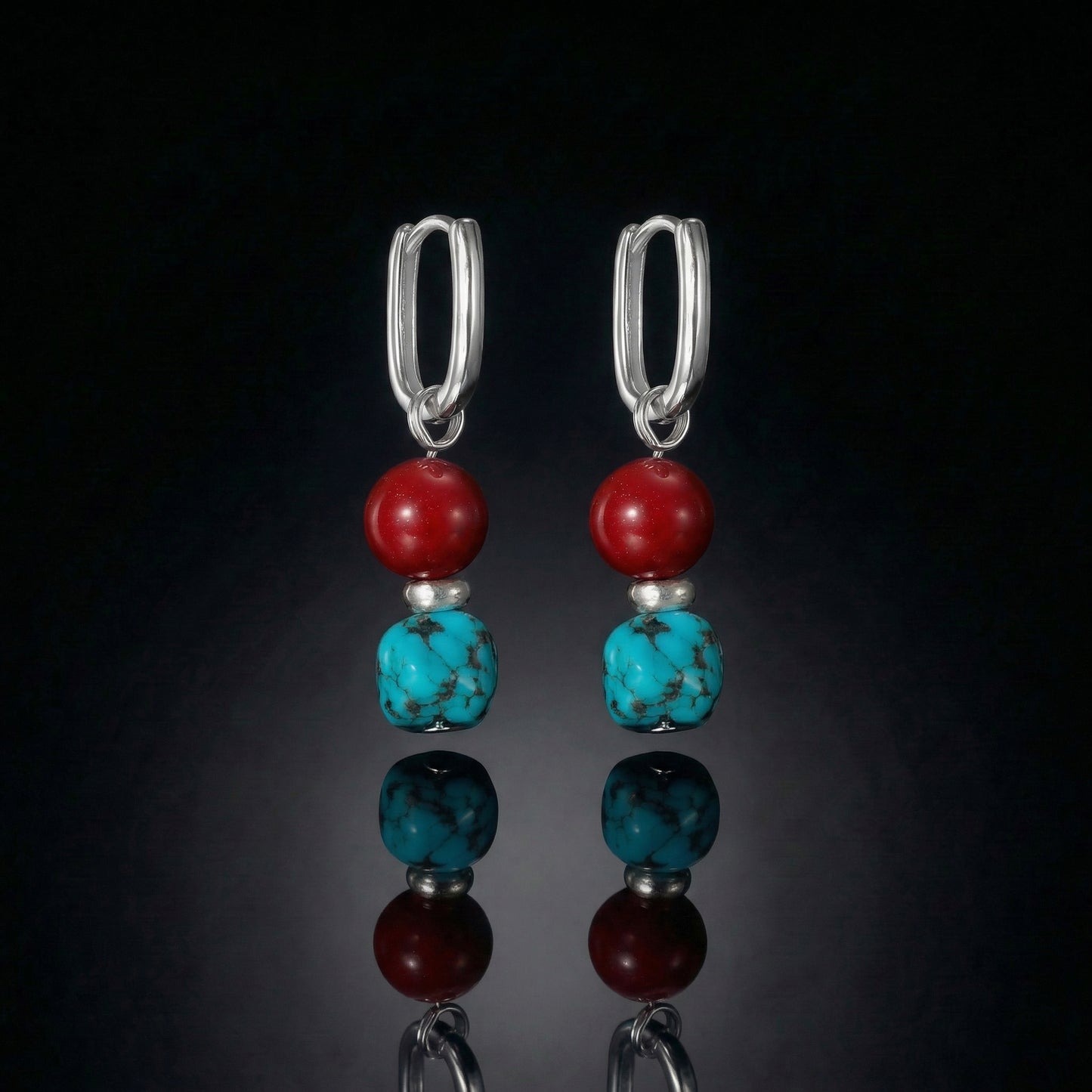 The Abundance Drops featuring natural Tibetan turquoise, deep red beads, and modern U-shaped sterling silver hoops.