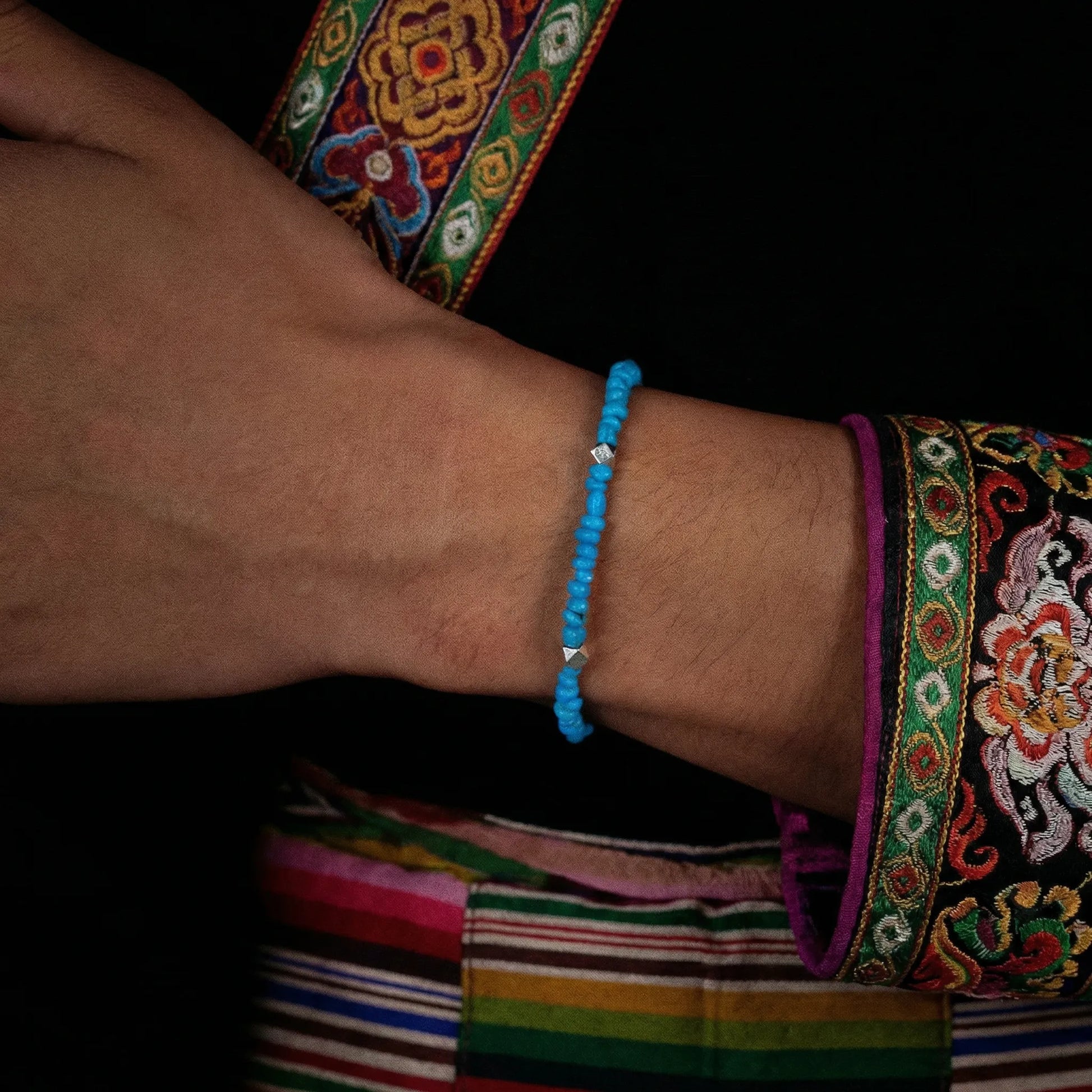Side view of the Clear Sky bracelet on a wrist, highlighting its thin and elegant profile.
