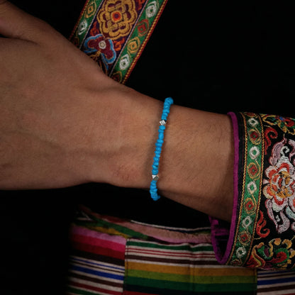 Side view of the Clear Sky bracelet on a wrist, highlighting its thin and elegant profile.