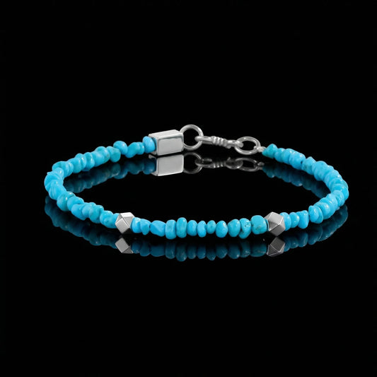 The Clear Sky Bracelet featuring natural turquoise rondelle beads and silver geometric spacers.