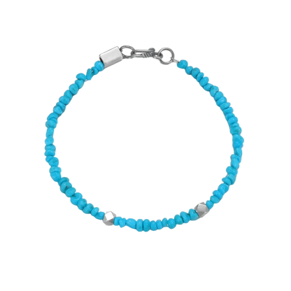 Top down view of the Clear Sky Tibetan turquoise bracelet laid flat, emphasizing stone uniformity.