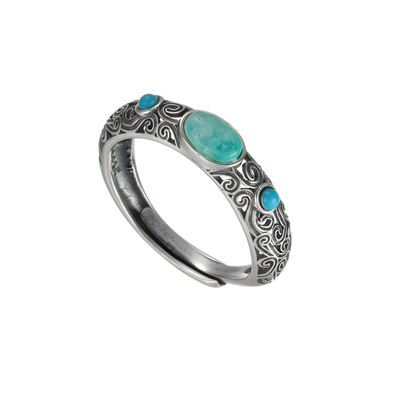 Full view of the Eternal Scroll ring on a white background, highlighting the adjustable open-back design.