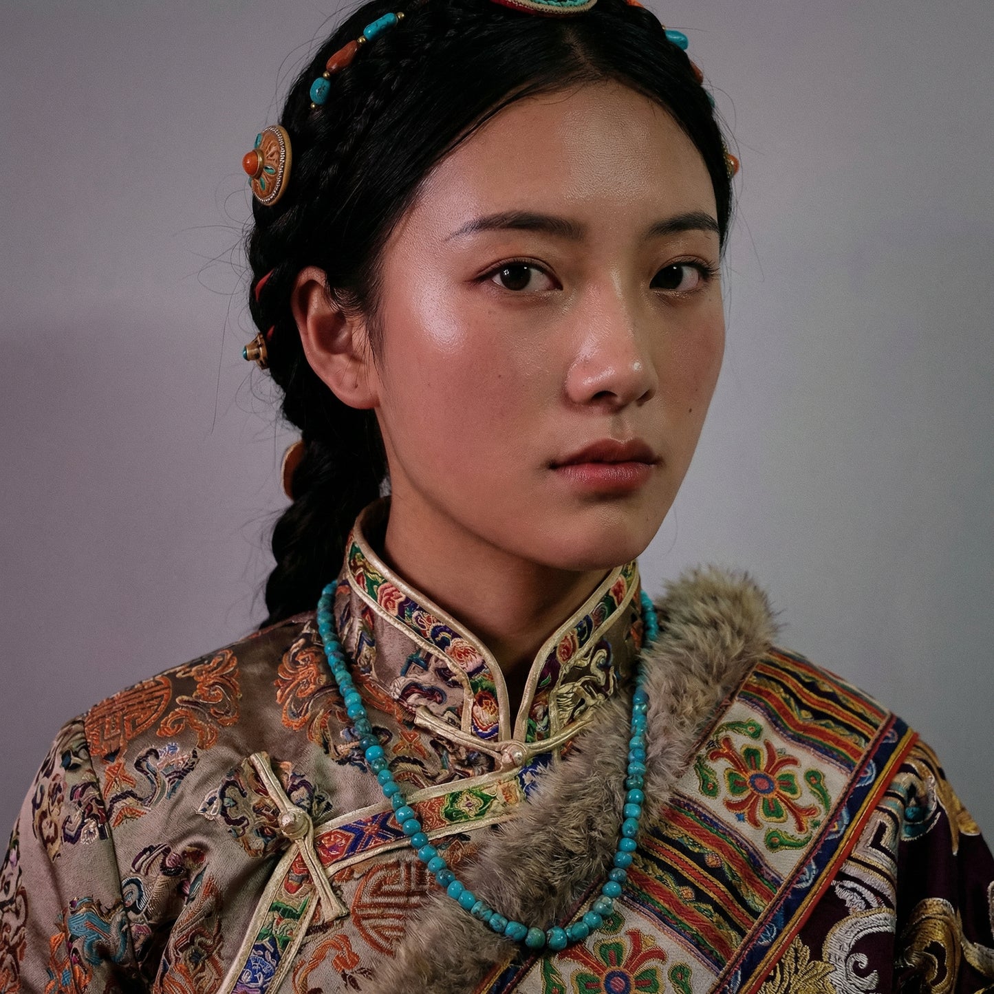 Portrait of a woman in traditional attire wearing the natural turquoise chip necklace for spiritual grounding.