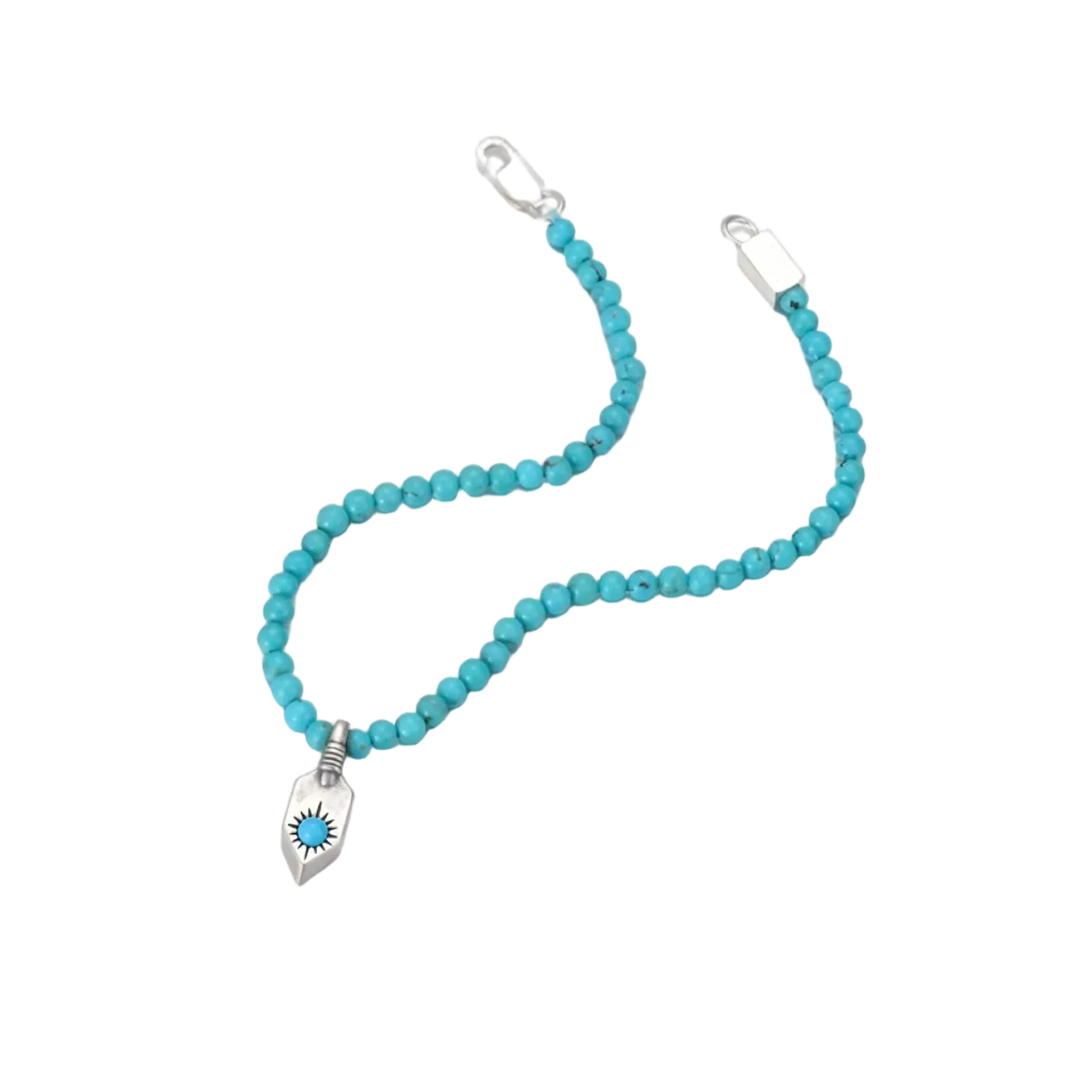 Angled view of the fluid turquoise bead bracelet and the hand-stamped silver shield charm.