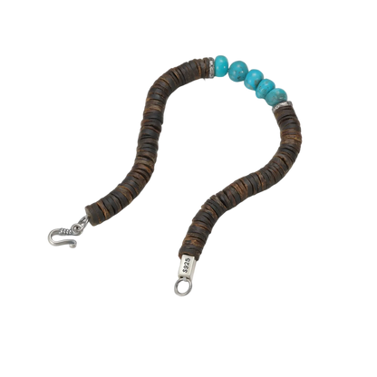 Full view of the grounding bracelet laid out on a white background, highlighting the silver clasp and turquoise stones.