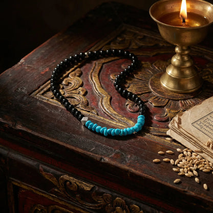 The Quiet Dawn necklace displayed on a traditional Tibetan altar, reflecting Himalayan heritage and ritual.