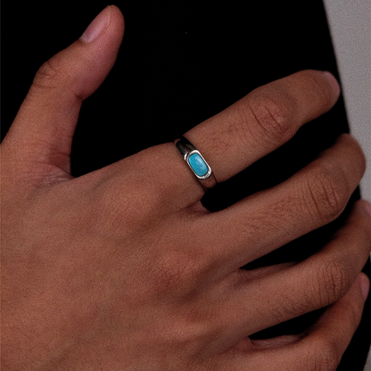 The Horizon Ring displayed on a piece of vintage handmade paper with a calligraphy pen.