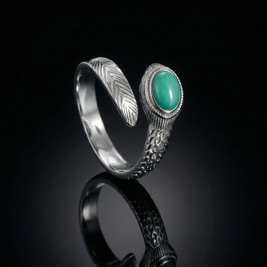The Insight Feather Ring featuring a detailed sterling silver feather wrap design and turquoise stone.