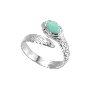 Top view of the Insight Feather ring on a white background, highlighting the turquoise "eye."