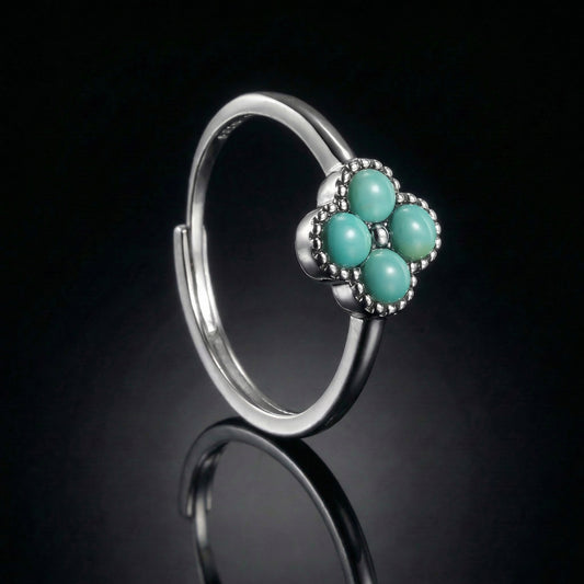 The Mandala Ring featuring four round Tibetan turquoise stones in a milgrain sterling silver setting.