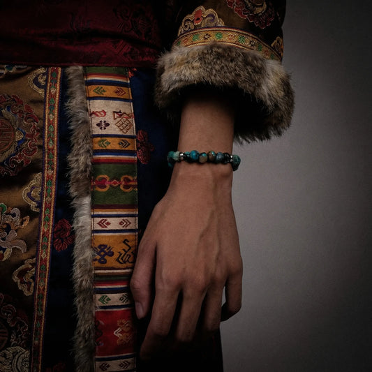 Close-up of a model wearing the Pilgrim's Path bracelet, styled with traditional Himalayan attire.