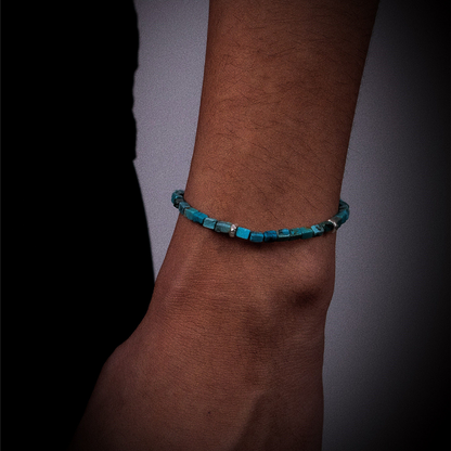 The Clarity turquoise bracelet worn on a model's wrist, reflecting a sophisticated and intellectual style.