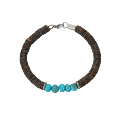 Full circle view of the Tibetan turquoise and organic disc bead bracelet on a white background.