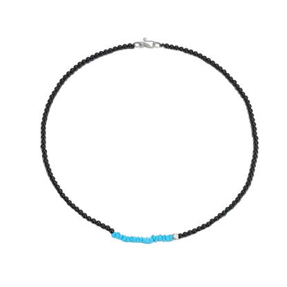 Full circle view of the Quiet Dawn Tibetan turquoise and grounding stone necklace on a white background.