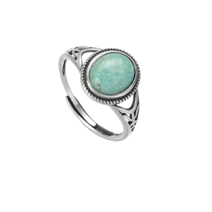 Top view of the Nomad's Shield turquoise ring on a white background, highlighting the rope texture.