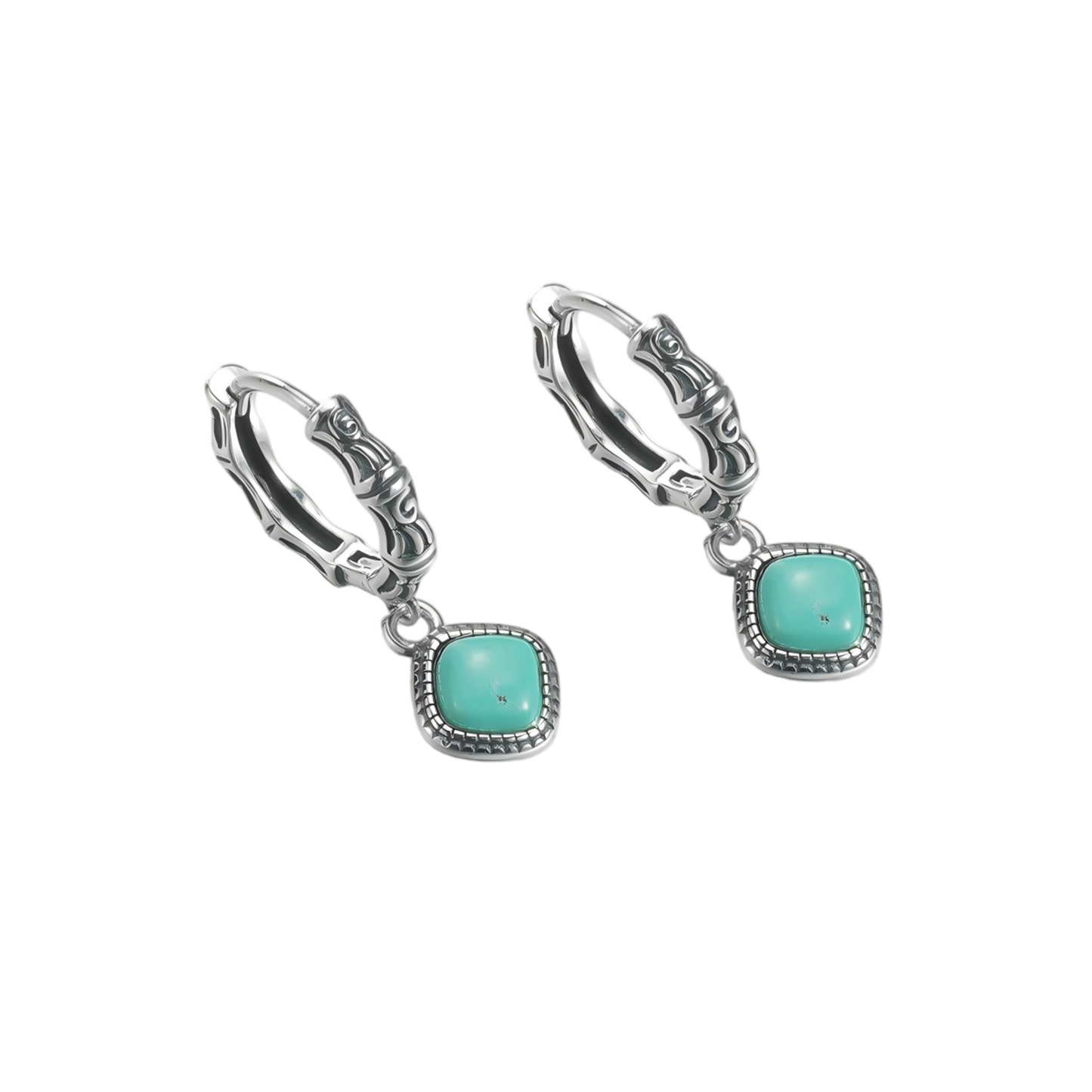 Angled view of the Sentinel Drops pair on a clean white background, showcasing the studded silver bezels.