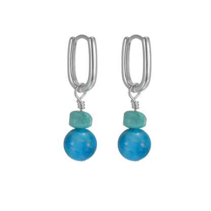 Front view of the Serene Drops pair on a clean white background, showcasing the vibrant water-blue stones.