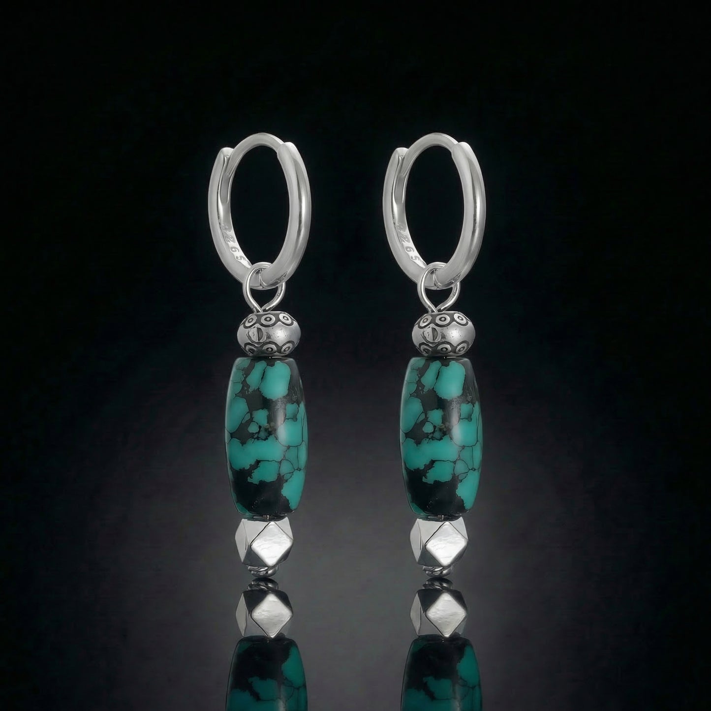 The Pillar Drops featuring elongated Tibetan turquoise cylinders and armored sterling silver hardware.