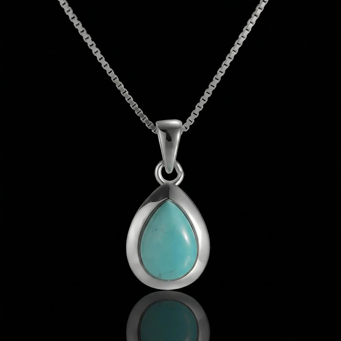 The Pure Drop Necklace featuring a teardrop-shaped Tibetan turquoise in a sleek 925 sterling silver bezel.