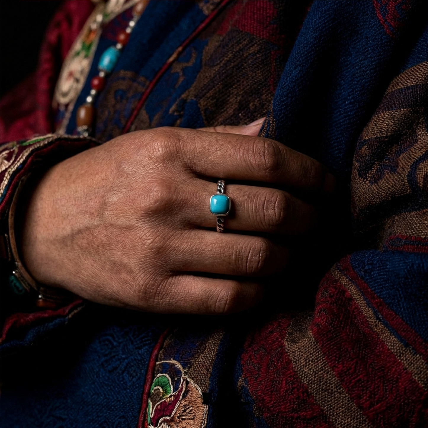 The Rational Link ring styled with traditional Himalayan-inspired attire for a heritage look.