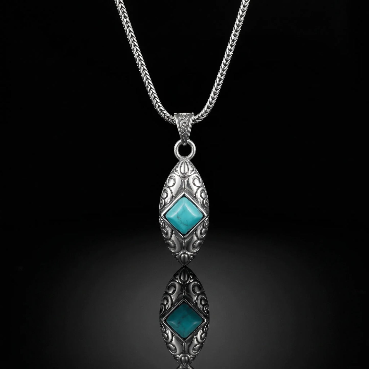 The Sentinel Crest Necklace featuring diamond-shaped Tibetan turquoise and oxidized silver scrollwork.
