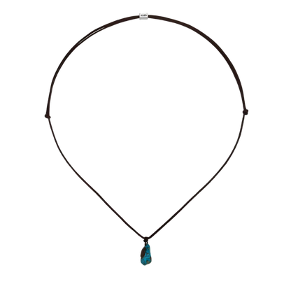 Full view of the solitary stone necklace with its soft woven cord on a clean white background.