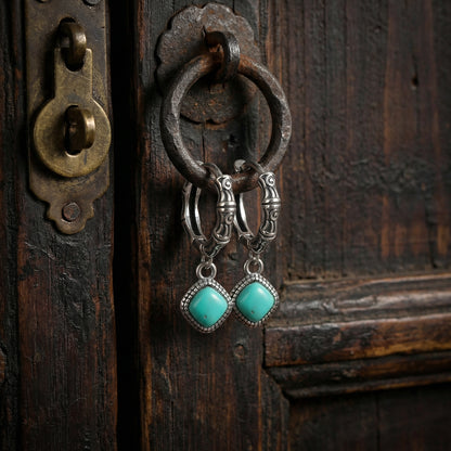 The Sentinel Drops displayed on an ancient wooden door handle, reflecting Himalayan heritage and enduring strength.