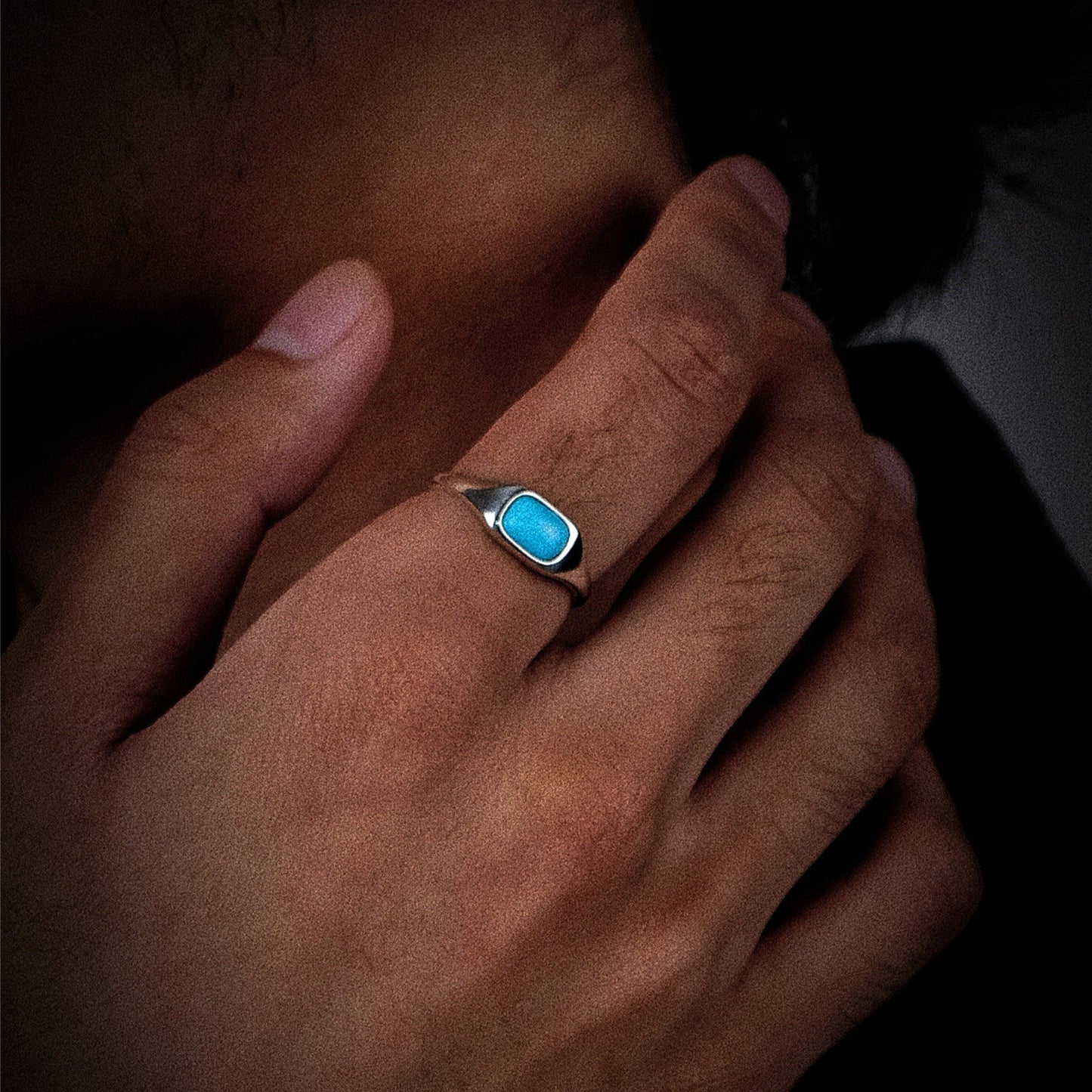 Side view of the Stillwater signet ring on a model, highlighting the high-polish silver finish.