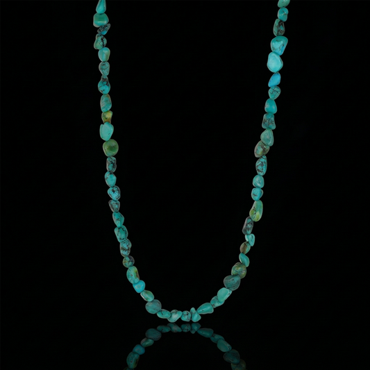 The Plateau Stream Necklace featuring a continuous strand of natural Tibetan turquoise chips on a black background.
