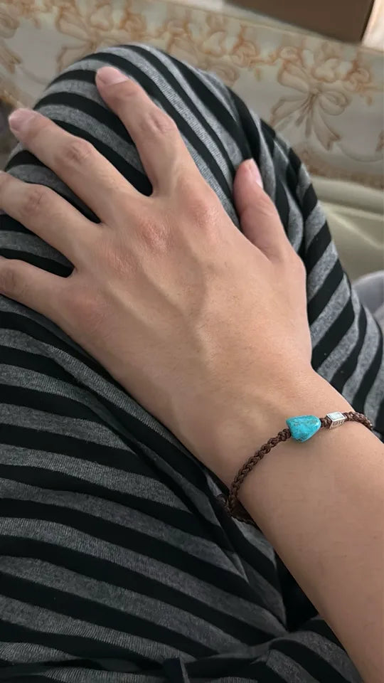 Customer wearing a Tibetan turquoise bracelet in an everyday setting