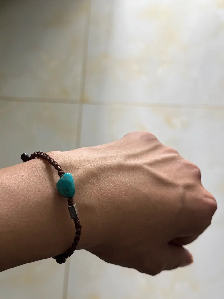 Customer wearing a simple Tibetan turquoise cord bracelet