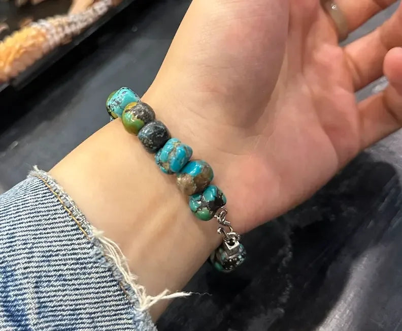Customer wearing a multistone Tibetan turquoise bracelet