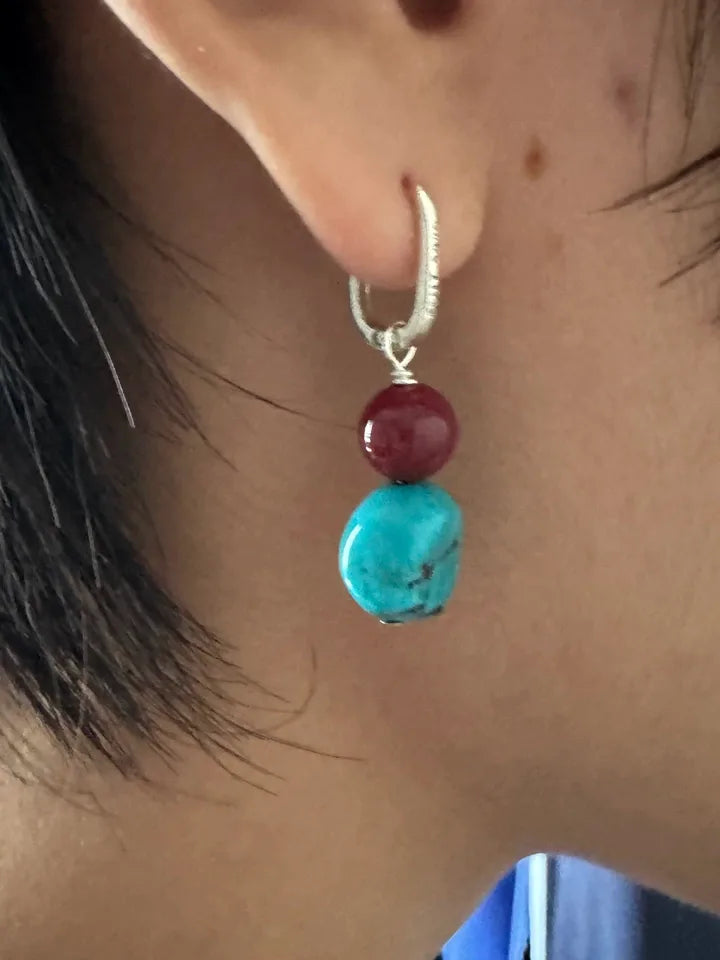 Customer wearing Tibetan turquoise drop earrings with sterling silver