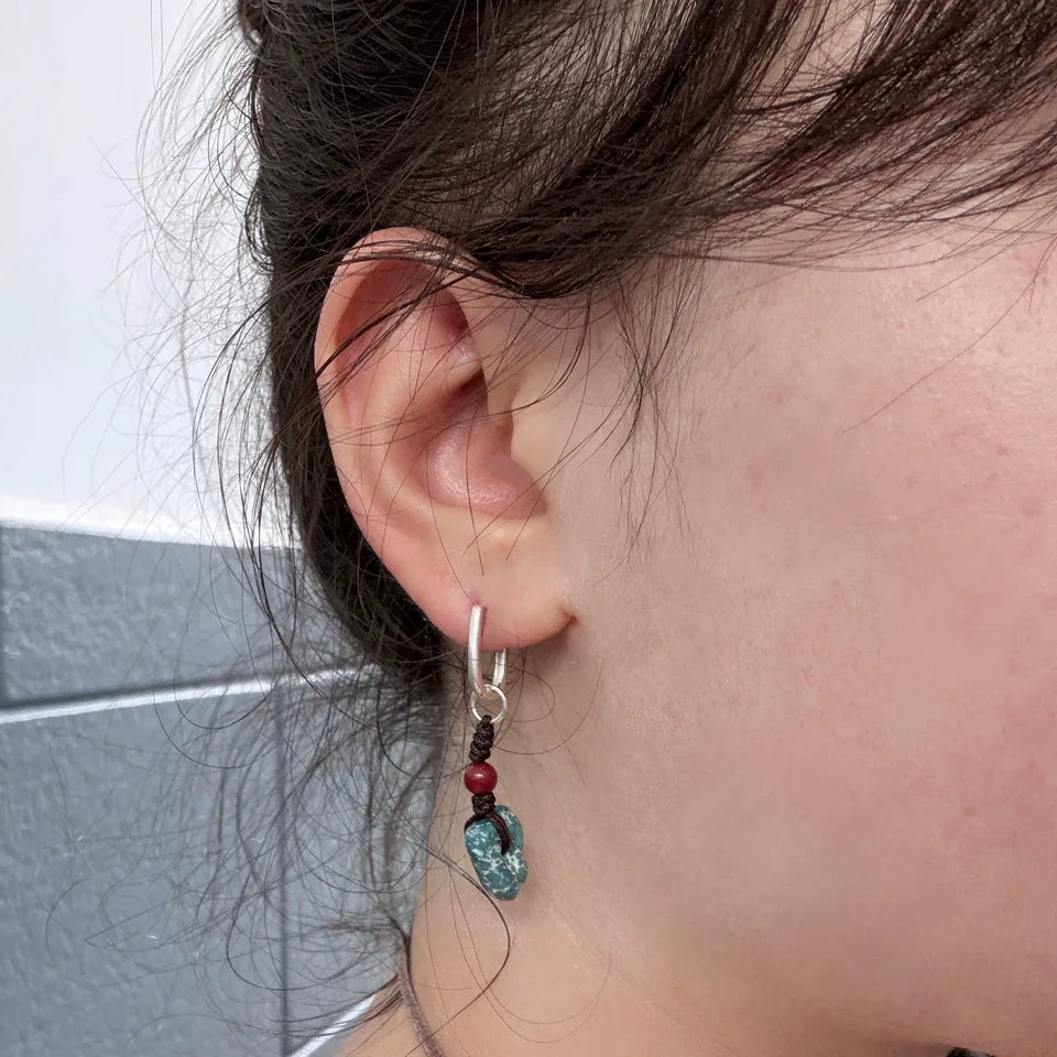 Customer wearing Tibetan turquoise and red bead drop earrings