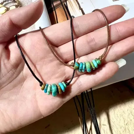 Customer holding Tibetan turquoise necklaces with natural stone beads